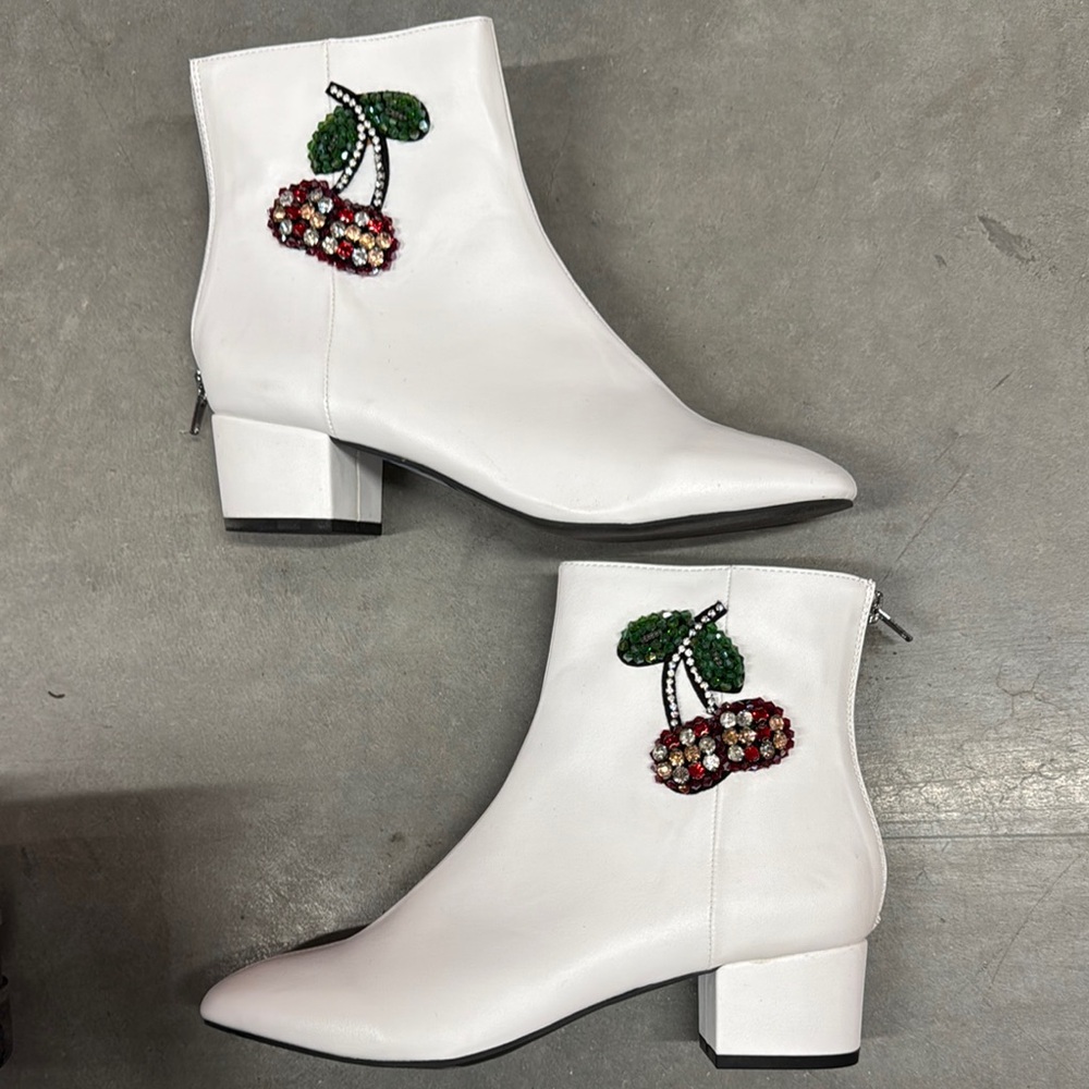 White ankle boots with a low block heel and decorative cherry embroidery